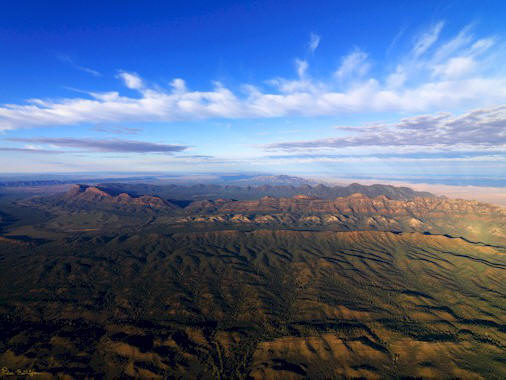 The rugged peaks of the Flinders Ranges looking towards Hawker. The parallel ridges include the Heysen Range, the ABC Range and the iconic Wilpena Pound in the centre of the picture.